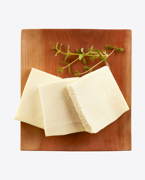 Cheese Slices on Wooden Plate
