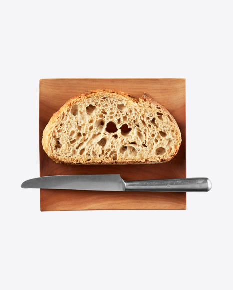 Bread Slice with Knife on Wooden Plate