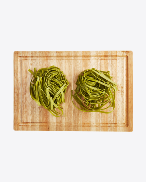 Basil Tagliatelle Pasta on Wooden Cutting Board