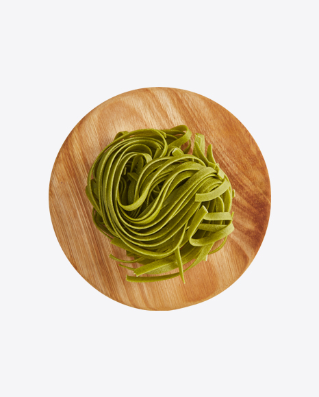 Basil Tagliatelle Pasta on Wooden Cutting Board
