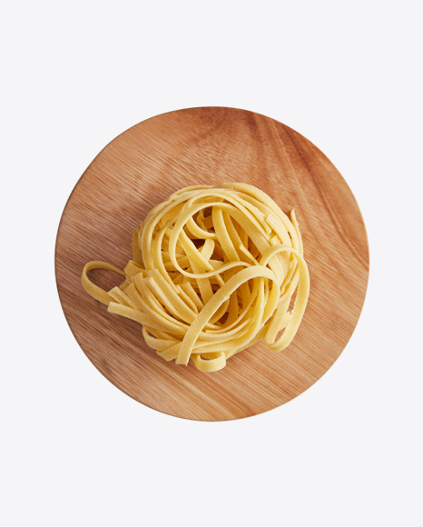Tagliatelle Pasta on Wooden Cutting Board