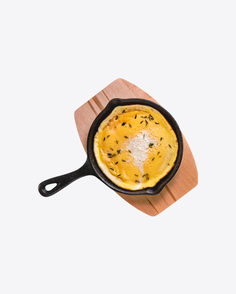 Omelette in Iron Pan on Wooden Board PNG