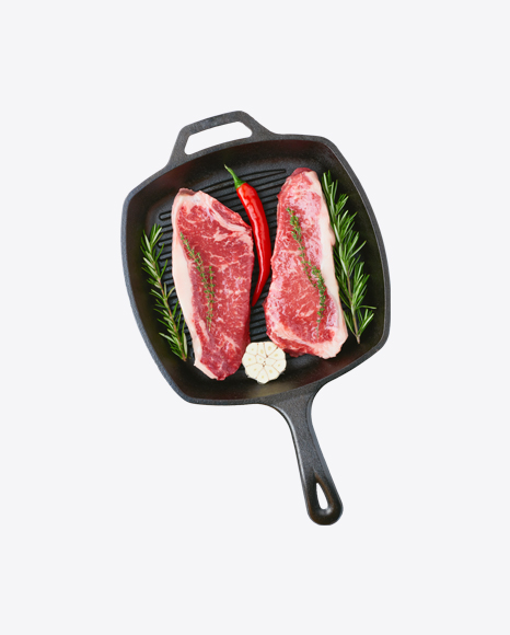 Raw Steak on Iron pan w/ Chili Pepper & Rosemary